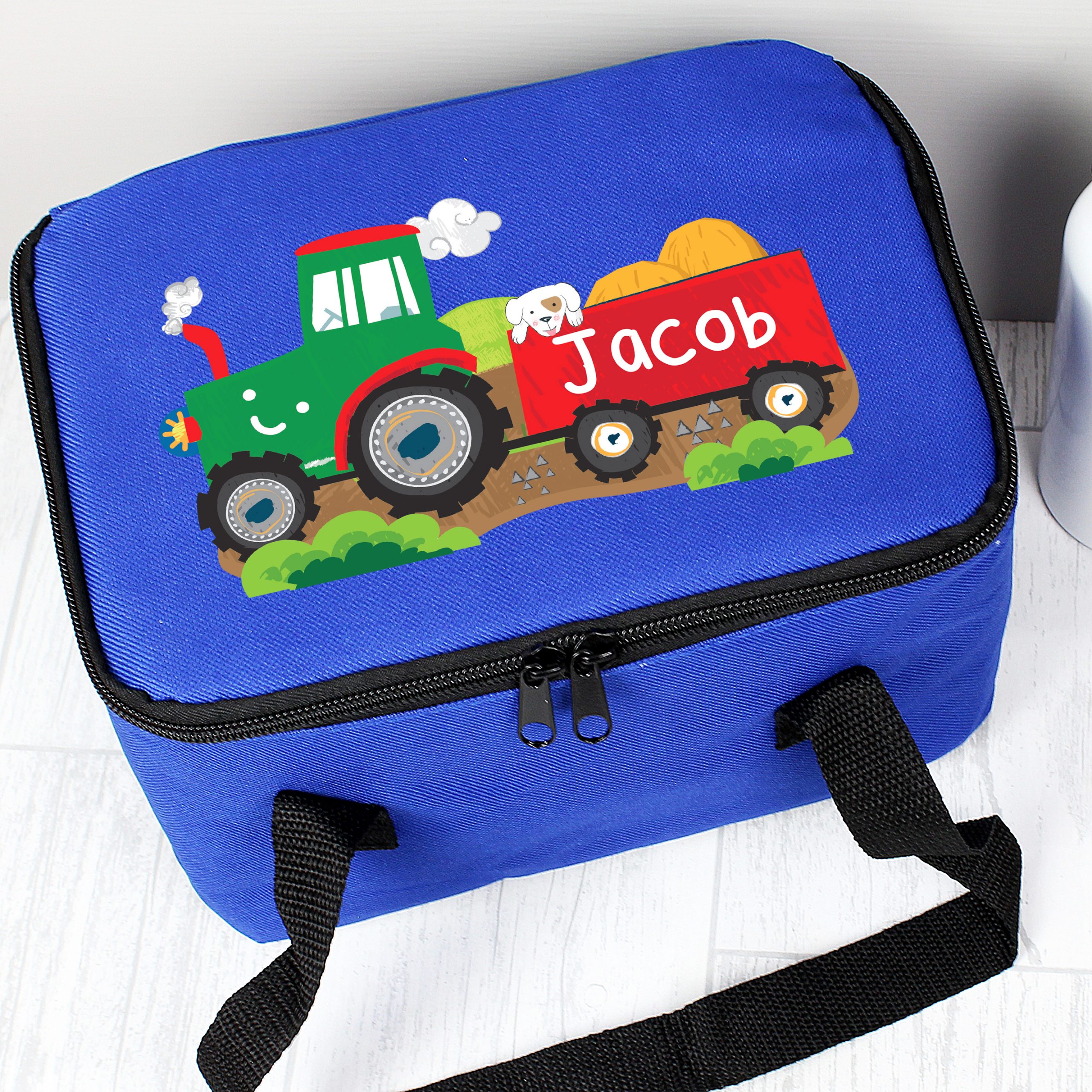https://www.personalisedkidsgifts.co.uk/wp-content/uploads/2019/07/Personalised-Tractor-Lunch-Bag-1-scaled.jpg